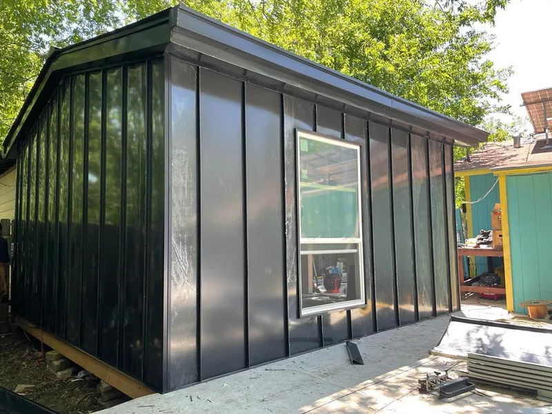 Black standing seam metal wall panels for Roof Inspection in Carlyss